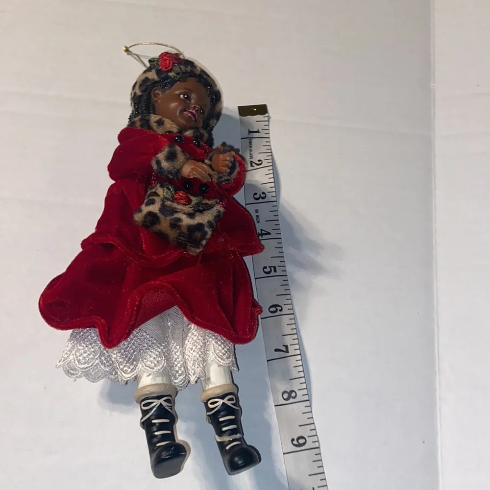 Vintage African American doll ornament with red velvet and leopard fur purse